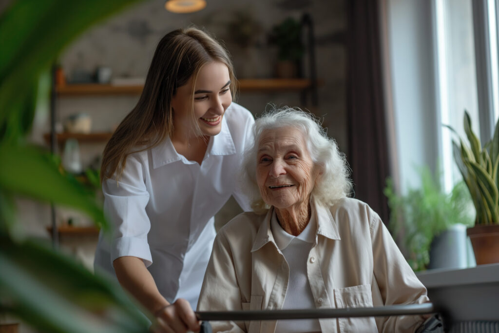 realistic scene with health worker taking care elderly patient.A smiling young female caregiver in a white shirt stands behind an elderly woman with white hair, who is sitting and looking forward with a cheerful expression in a brightly lit room.